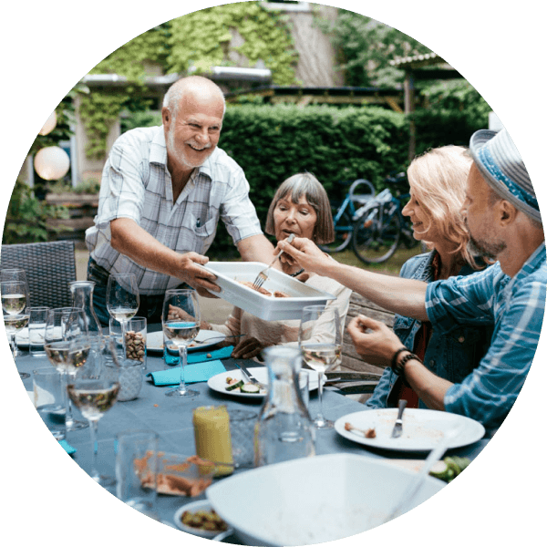 Family gathering over outdoor dining table